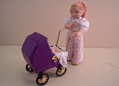 1" scale Jan Smith toddler Clara pushing her baby carriage